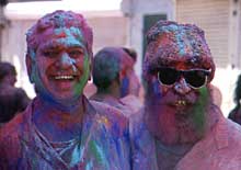 Faces of two men after they have played Holi really well.