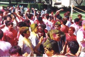 A crowd of people playing Holi